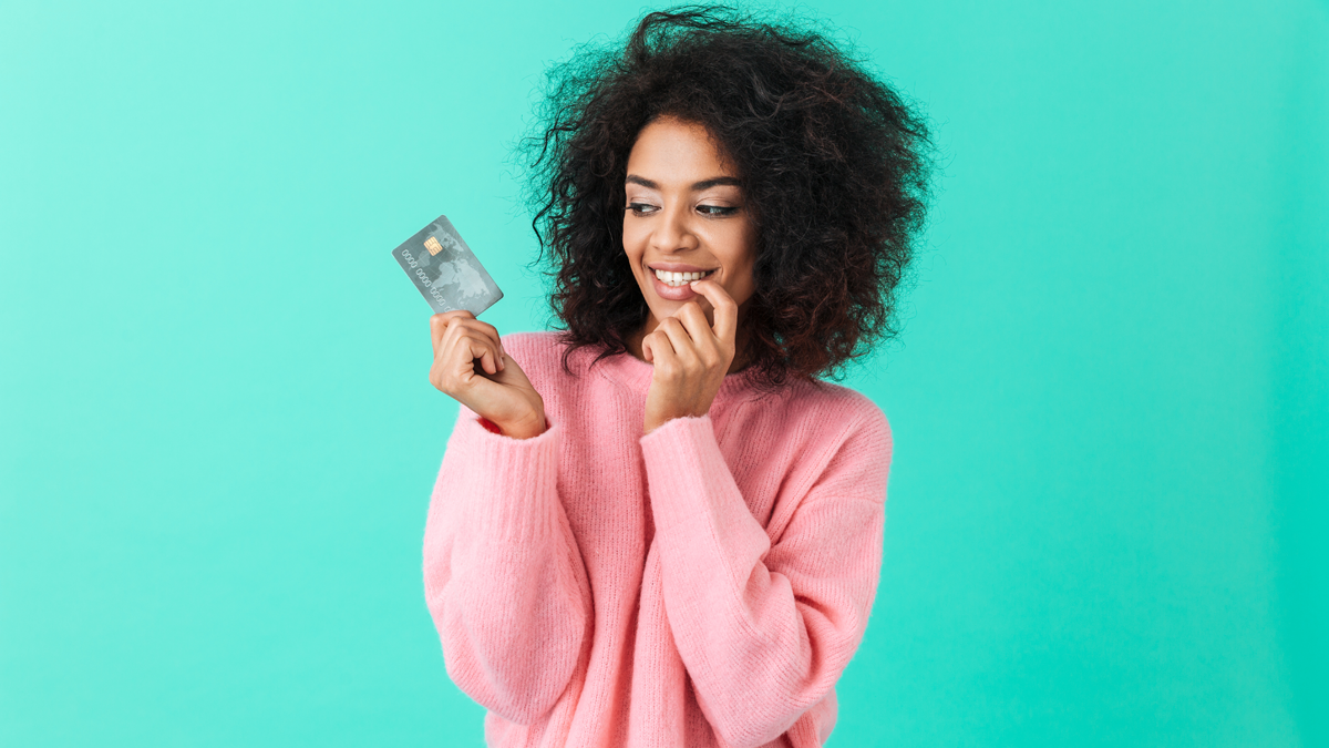 black woman holding a credit card